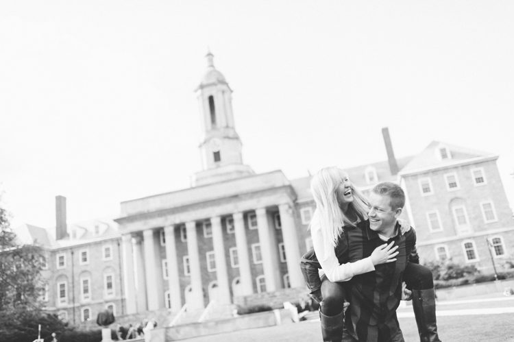 Lauren and Ben play around  the Old Main Lawn during their engagement session at Penn State. Captured by NYC wedding photographer Ben Lau.