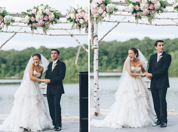 Bride and groom laugh at the altar on the day of their Rock Island Country Club wedding in Sparta, NJ. Captured by Karis of Ben Lau Photography.
