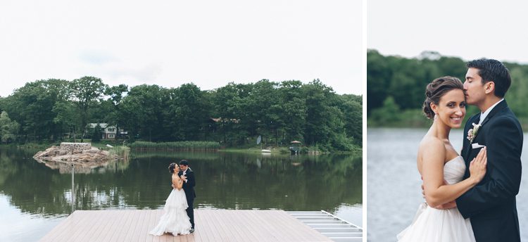 Bride and groom slow dance on a lakeside dock on the day of their Rock Island Country Club wedding in Sparta, NJ. Captured by Karis of Ben Lau Photography.