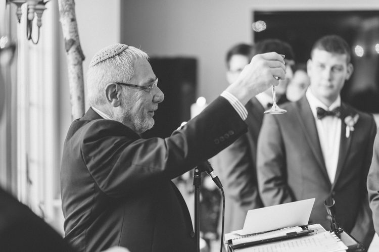 Rabbi gives blessings during a Rock Island Lake Club Wedding in Sparta, NJ. Captured by NJ wedding photographer Ben Lau.