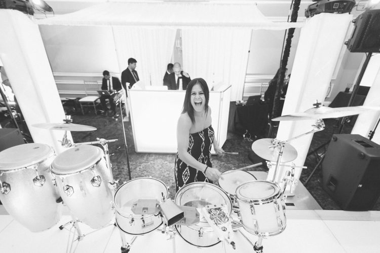 Band playing the drums during a wedding reception at Oheka Castle in Long Island, NY. Captured by NYC wedding photographer Ben Lau.