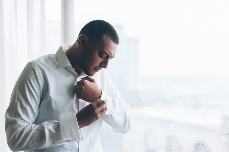 Groom gets ready on the morning of his Seaport Hotel wedding in Boston, MA. Captured by NYC wedding photographer Ben Lau.