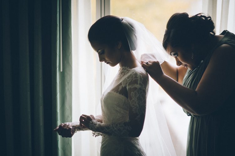 Bride gets ready on the morning of her Seaport Hotel wedding in Boston, MA. Captured by NYC wedding photographer Ben Lau.