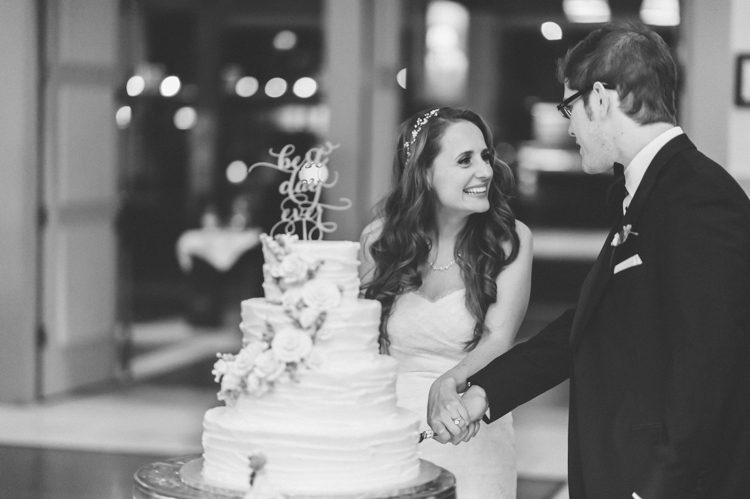Cake cutting during a wedding at the Stone House in Stirling Ridge. Captured by NJ wedding photographer Ben Lau.