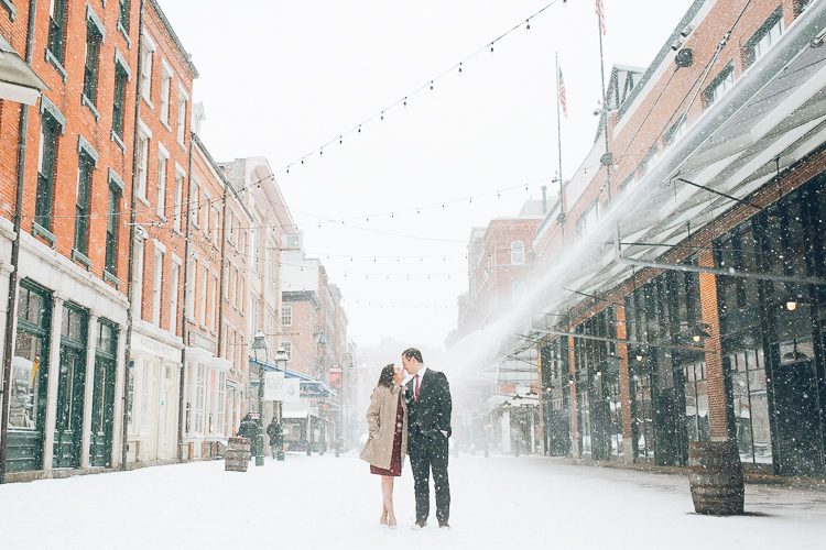 Snowy engagement session in South Street Seaport, captured by fun NYC wedding photographer Ben Lau Photography.
