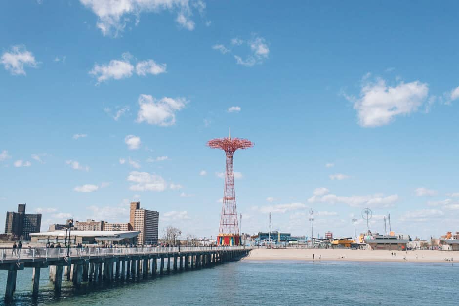 Coney Island engagement session in Brooklyn, NY - captured by photojournalistic NYC wedding photographer Ben Lau.